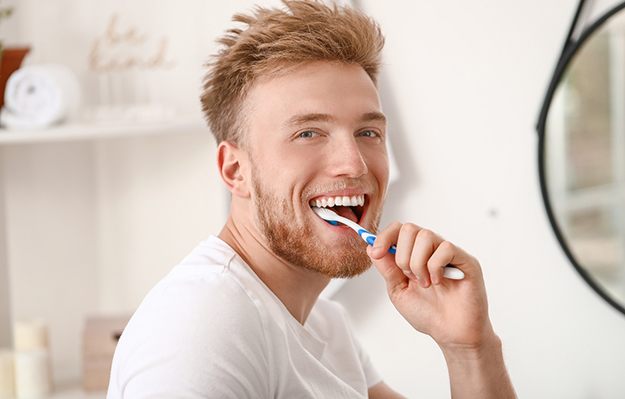 A man brushing his teeth