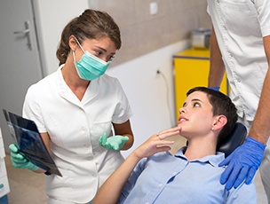 Patient in Selbyville reviewing root canal cost with dental team  