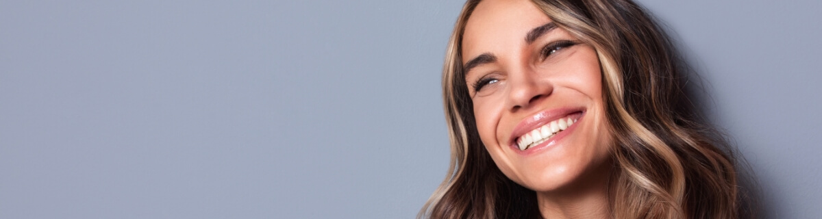 Woman grinning after treatment with Six Month Smiles in Selbyville