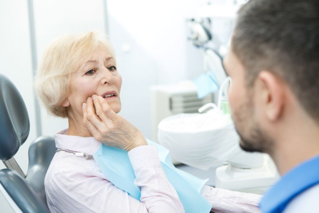 A woman with denture pain.